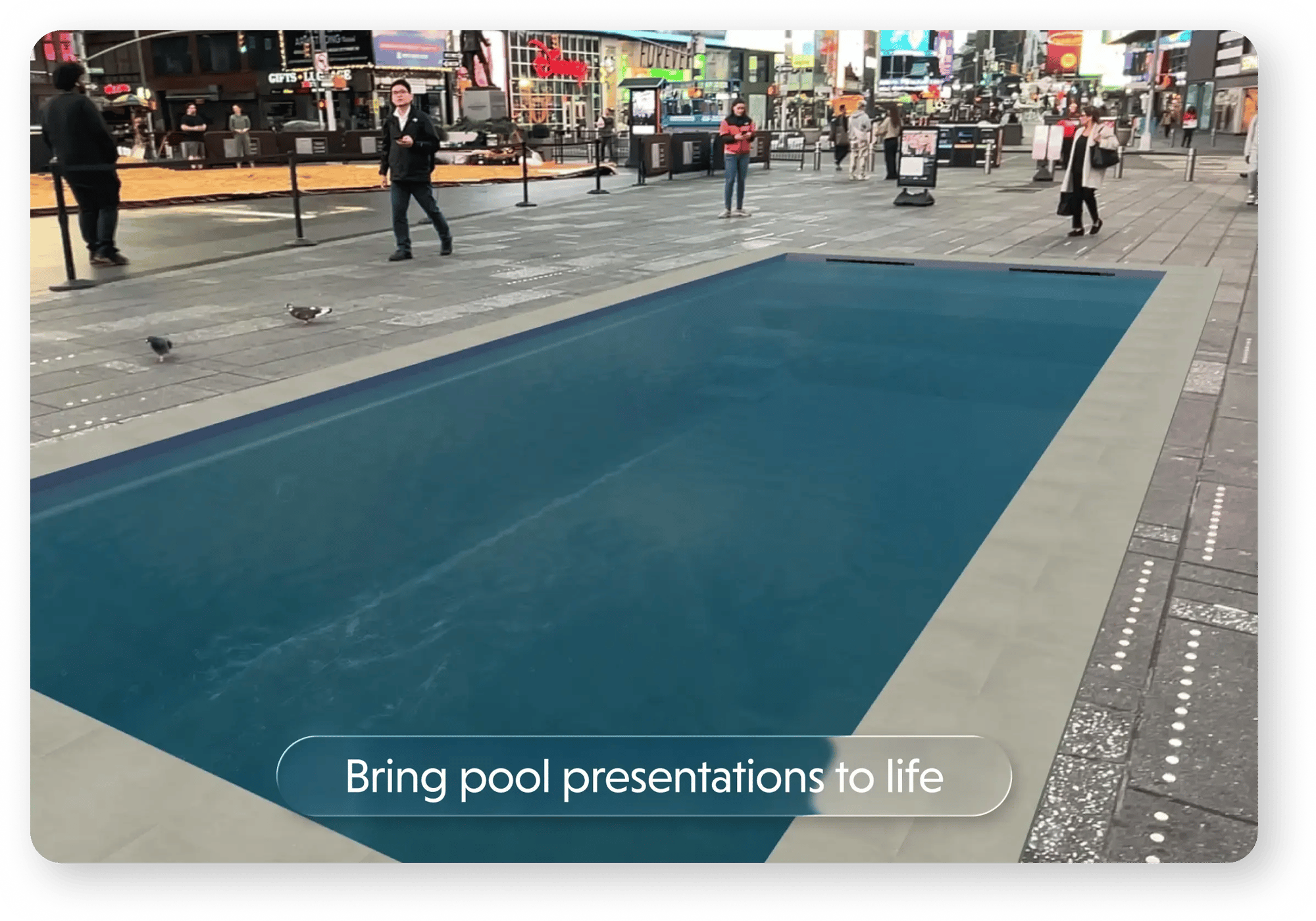 Augmented reality pool design projected onto the pavement in Times Square, New York, showing a full-size swimming pool overlaid in a busy urban setting during a live preview. Augmented reality pool design projected onto the pavement in Times Square, New York, showing a full-size swimming pool overlaid in a busy urban setting during a live preview.